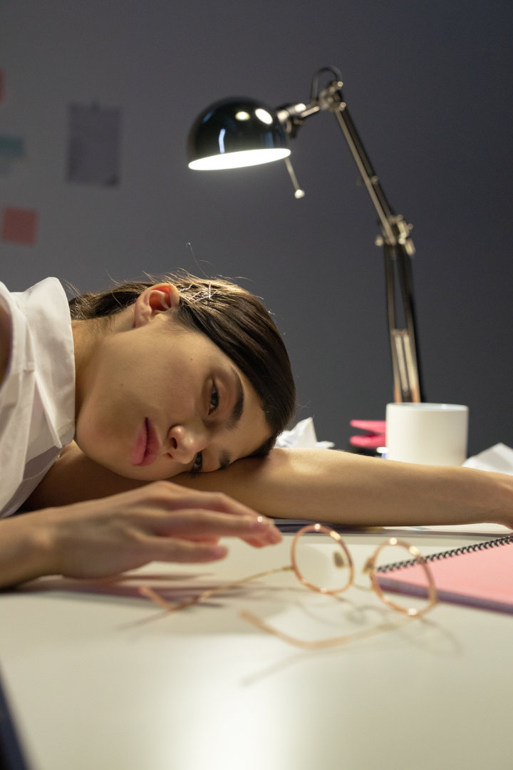 frustrated girl lying on office